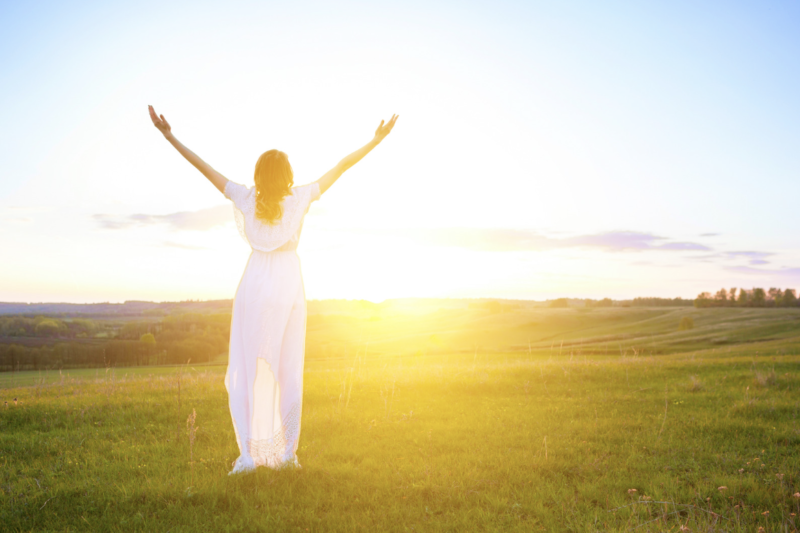 Girl at sunrise divine assistance