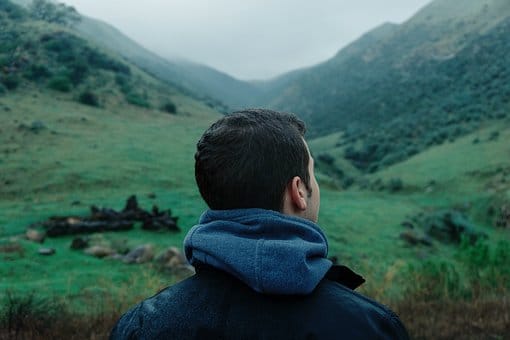 Guy looking over hills